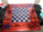 Custom woodworking: wooden chess board with blue and silver squares and stars