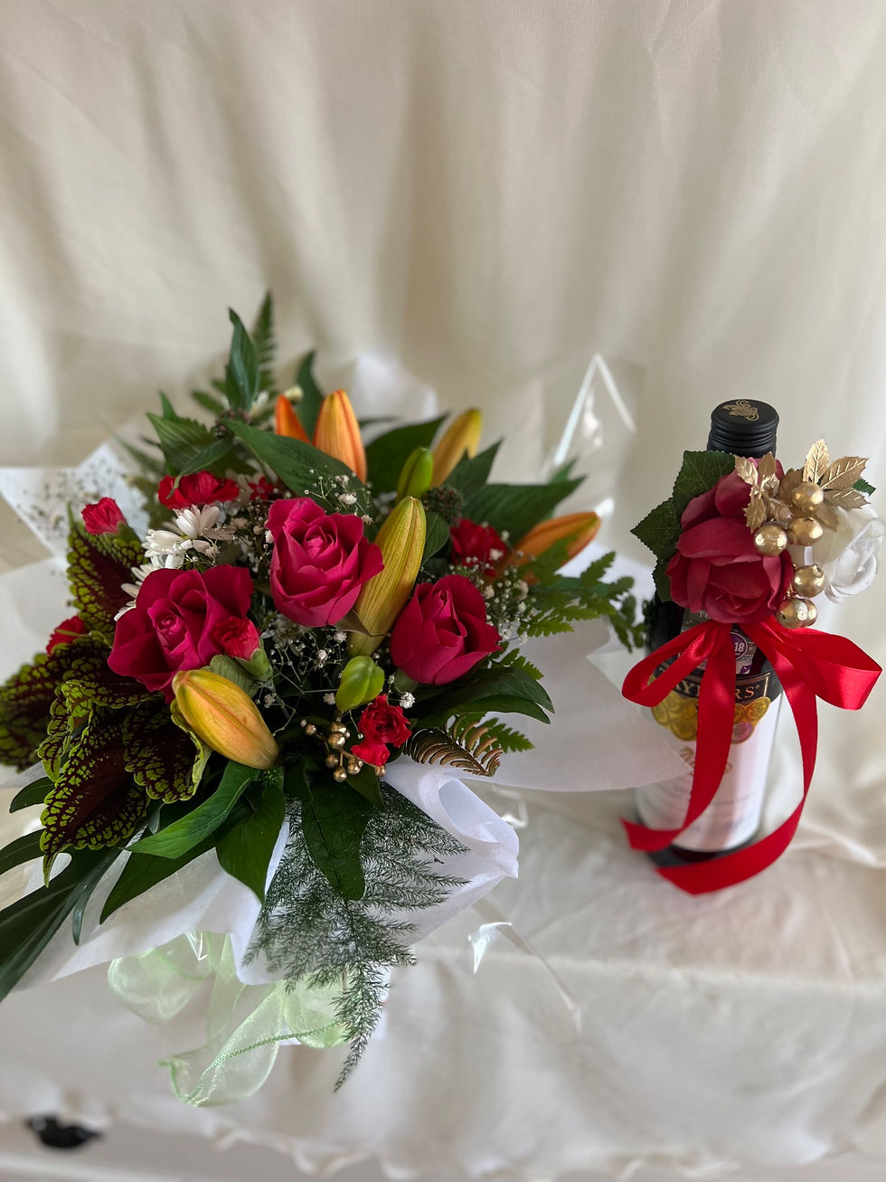 Thumbnail: Bottle of Wine Decorated With Flowers and Ribbion