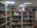 Racks of a liquor store filled with Wines and Whisky.