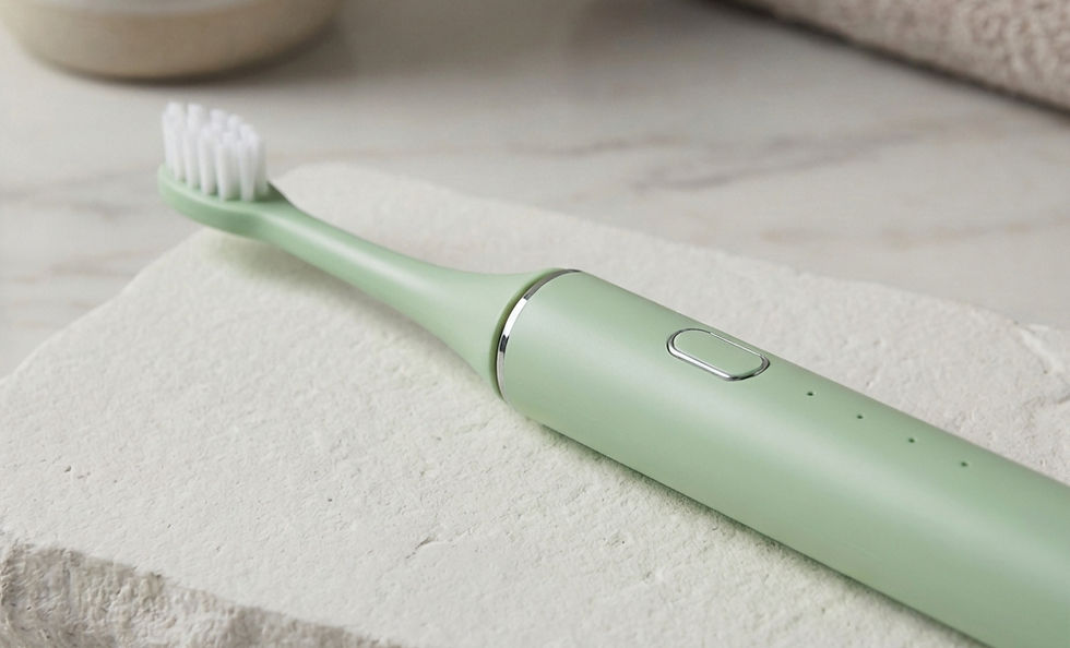 Bepulo L1 Next sustainable electric toothbrush with PLA casing in sage green on neutral stone background