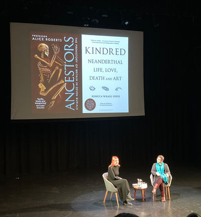 Rebecca Wragg Sykes and Alice Roberts on stage, Bristol, 2022. 
