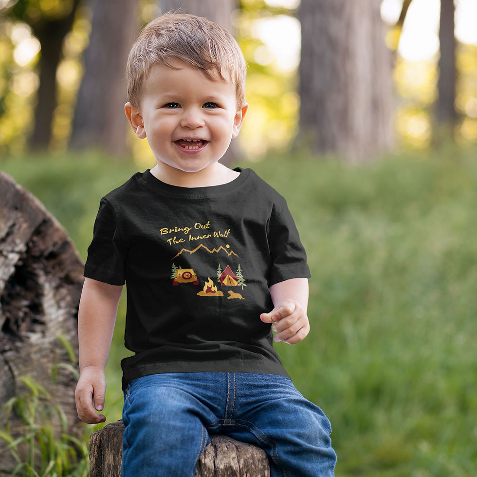 Toddler smiling and wearing a dog themed camping t-shirt