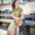 Thumbnail: Woman and dog wearing shirts with graphics of a dog running through a park and a San Diego city skyline in the background
