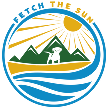 Fetch The Sun logo with dog on the beach in front of mountains with a shining sun.
