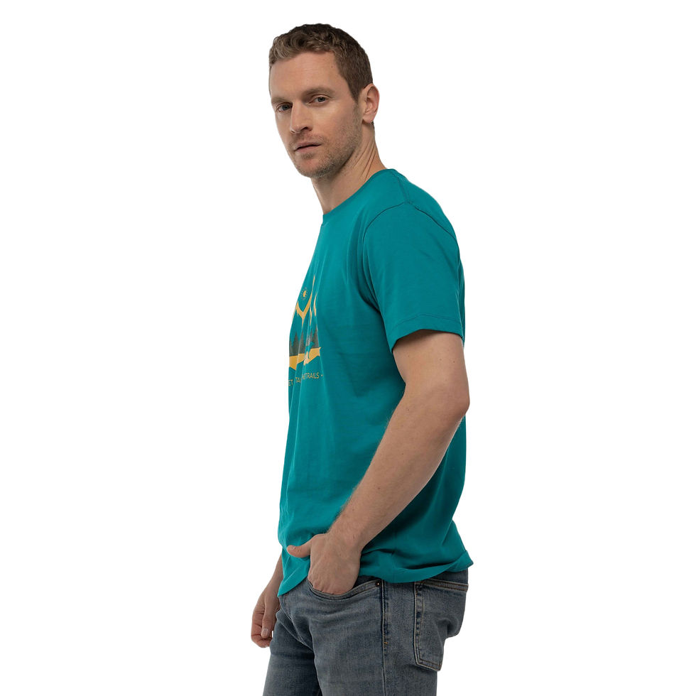 Thumbnail: Side view of a Serious man in a studio with white backdrop posing in a dog dad shirt in teal blue