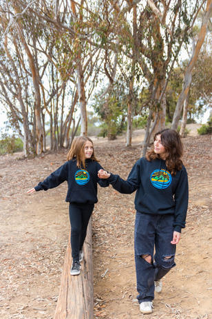 Riley Ryan and Hannah modelling Fetch The Sun logo shirts