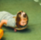 children coloring with paints on newspapers