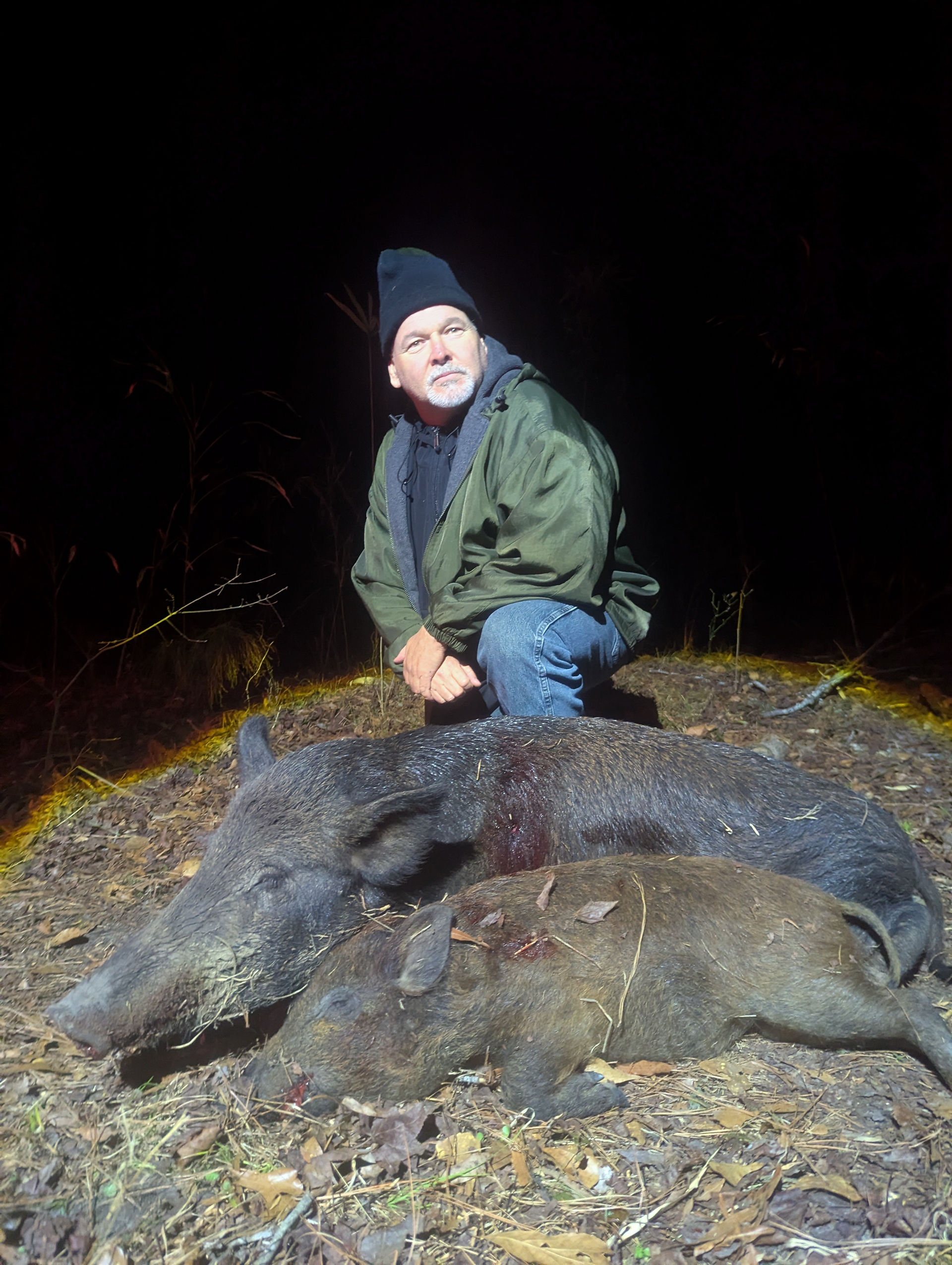 Hunter with two hogs in one night
