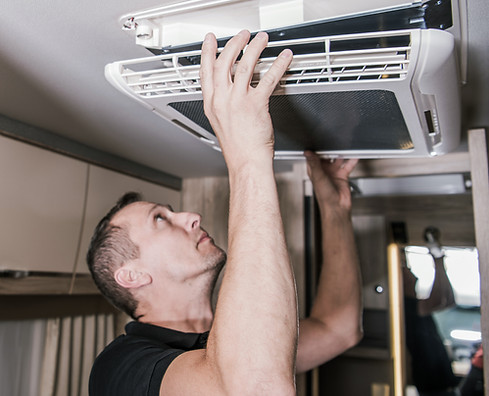 Caucasian RV Appliances Technician in His 40s at Work. Looking For Potential Issue with Ai