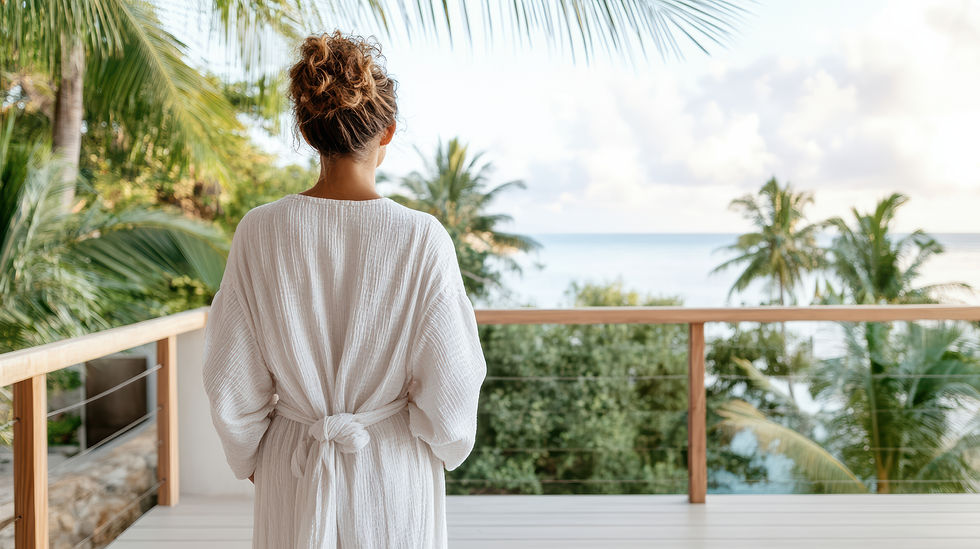 vecteezy_a-woman-in-a-robe-looking-out-over-the-ocean_70026896.jpeg