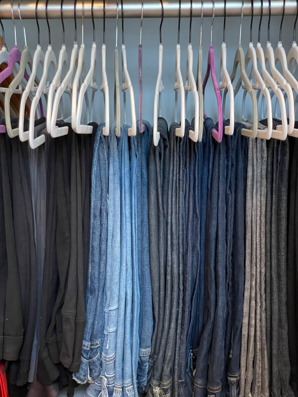 pants organized on hangers