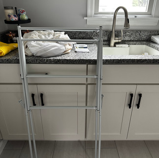 Folded drying rack blocking the use of cabinets