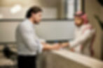 Businessman signing into accommodation in Saudi Arabia