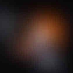 Relaxed moment: young guy lying on the court bench, eyes closed, sun on his chest