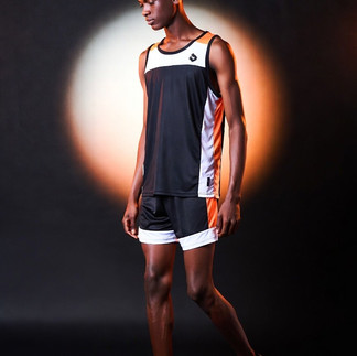 Golden sunlight highlighting the V-shape of a shirtless 20-year-old