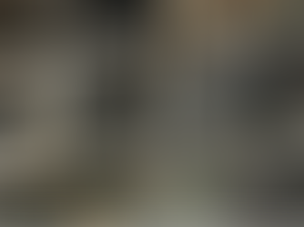 Rage room with broken glass and items on the floor