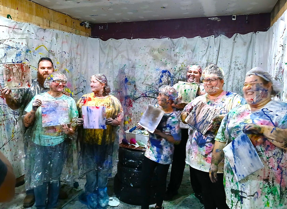 High angle view of a group enjoying paint splatter fun at Maximum Rage