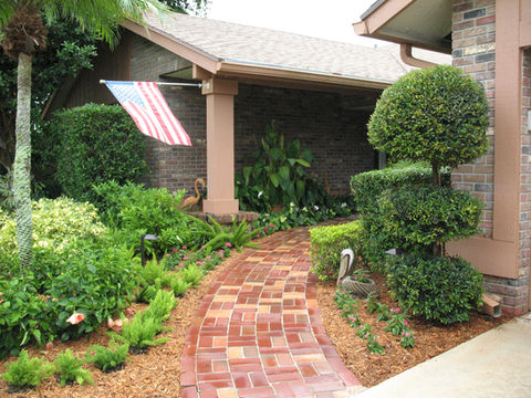 Brick pathway leads to house, American flag waving, landscape design, Home, GWG Landscape Design in lake placid