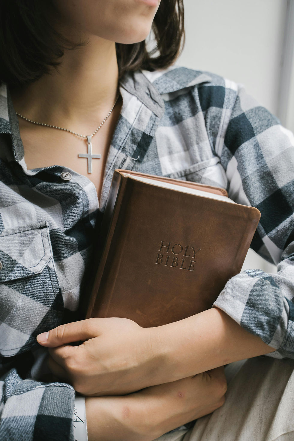 person holding the Holy Bible