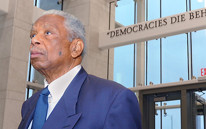 Judge Damon J. Keith near his quote on democracy, "Democracies die behind closed doors".