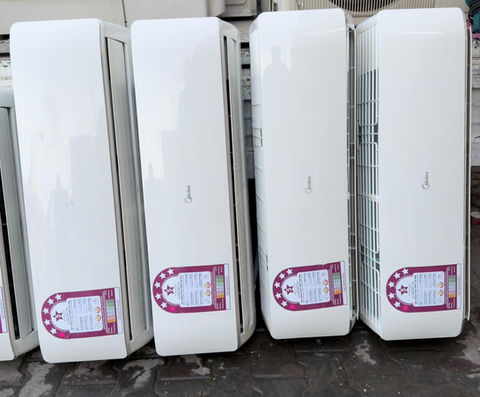White air conditioner units lined up