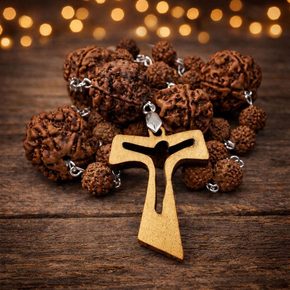 Brown Rudraksha Anglican rosary with a wooden cross bearing a dark figure of Christ on a wood surface.