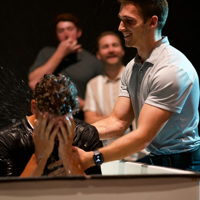 College student being baptized at Creekside Church by Aaron Andersen