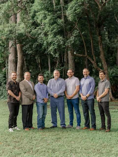 Group of seven pastors of Creekside Church by the creek