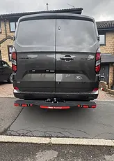 Ford Transit Custom rear with towbar, electrical socket and Rhino TowStep.