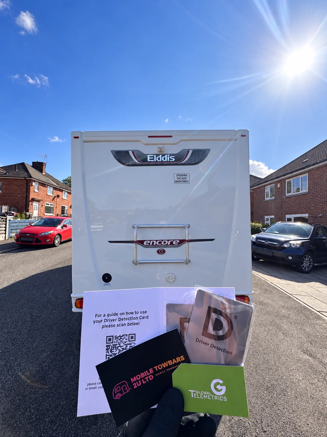 Elddis Encore motorhome with Driver Detection cards and Global Telemetrics handover materials.