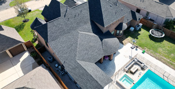 Garvin Exteriors IKO Dynasty Granite Black Shingles Roof Installation in Cypress Texas Towne Lake