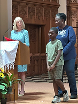 SCSL honors assembly - Mrs. Leamy standing with student