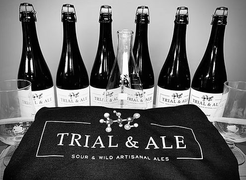 Contents of the Trial & Ale Blending Club including beer, glassware, t-shirt, and flask.