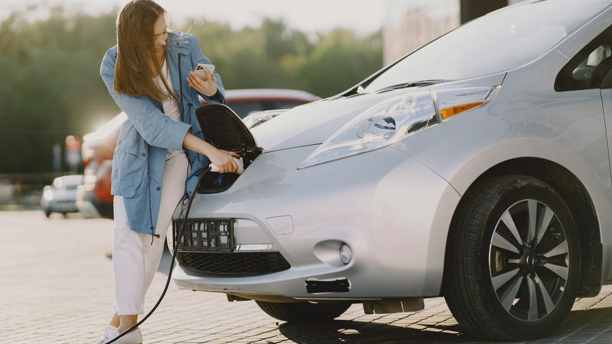 woman-charging-electro-car-at-the-electric-gas-station.jpeg