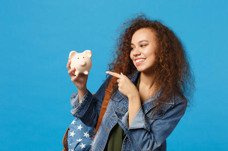 young-african-american-girl-teen-student-in-denim-clothes-backpack-hold-pig-isolated-on-bl