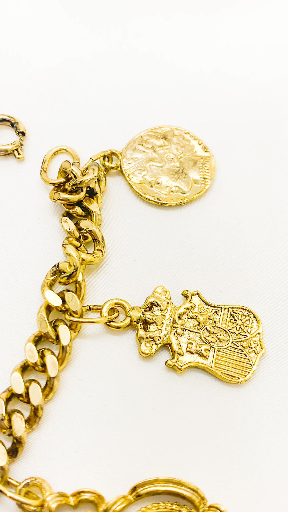 Thumbnail: 1980s Bronze Crown and Coin Charm Bracelet (AVAILABLE TO BUY IN STORE)