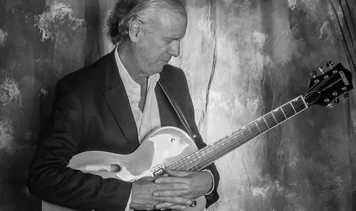 Will portrait with guitar bw(1).webp