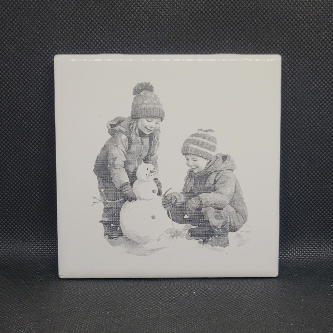 Kids Building Snowman Ceramic Tile Coaster