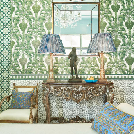 Green wallpapered Interior with Antique furniture, Sari cushions and lampshades