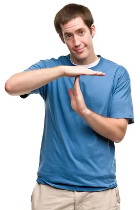 A man giving the time out sign