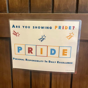 A sign that says "Are you showing pride?" "PRIDE" "Personal Responsibility in Daily Excellence