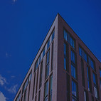 a tall brick building with lots of windo