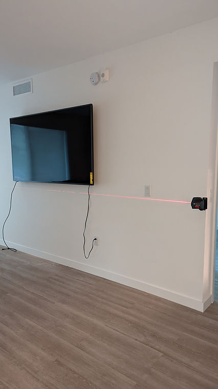 Well-mounted TV with hidden cables inside the wall in Fort Lauderdale, creating a sleek and clutter-free entertainment area.