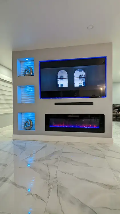 Modern family room with a wall-mounted TV and stylish decor in Hollywood, showcasing a sleek, clutter-free entertainment space