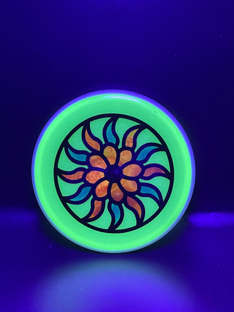 Frontside Blue and Orange Flower Spin Wheel Mini under blacklight
