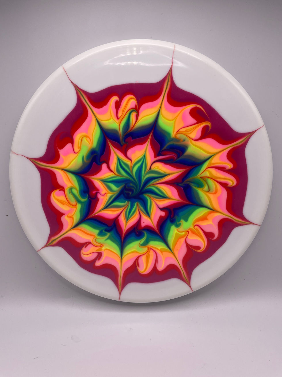 A bursting star dye with rainbow colors.