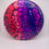 Thumbnail: Cell dyed disc with red cell fading into purple cells,
