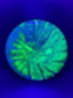 Frontside Blue and Green Spiral Burst Glitch under blacklight