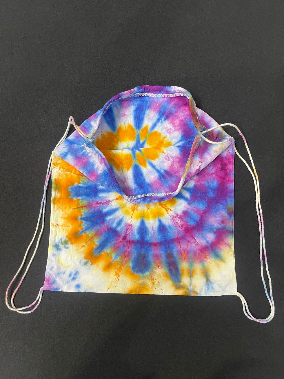 Thumbnail: A tie dyed spiral of pink, purple and orange, front inside view