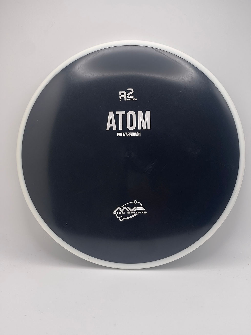 A black recycled plastic disc,